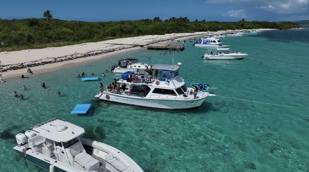 Aerial drone photo of boats along the Puerto Rico coastline, shot by Zoom Realty Services